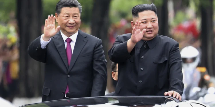 Chinese President Xi Jinping, left, and North Korean leader Kim Jong Un