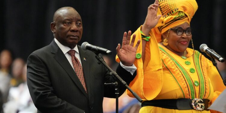 South African President Cyril Ramaphosa and Pemmy Majodina of the African National Congress (ANC) attend a swearing-in ceremony into the National Assembly during the first sitting of the National Assembly following elections, at the Cape Town International Convention Center (CTICC) in Cape Town, South Africa June 14, 2024.