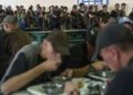 Prisoners wait in line for lunch in a prison, in the Dnipropetrovsk region, Ukraine, Friday, June 21, 2024.