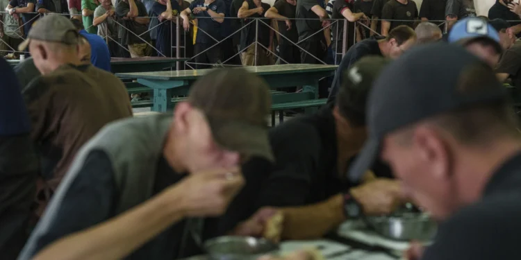 Prisoners wait in line for lunch in a prison, in the Dnipropetrovsk region, Ukraine, Friday, June 21, 2024.