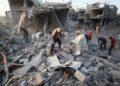 Palestinians-inspect-the-site-of-an-Israeli-strike