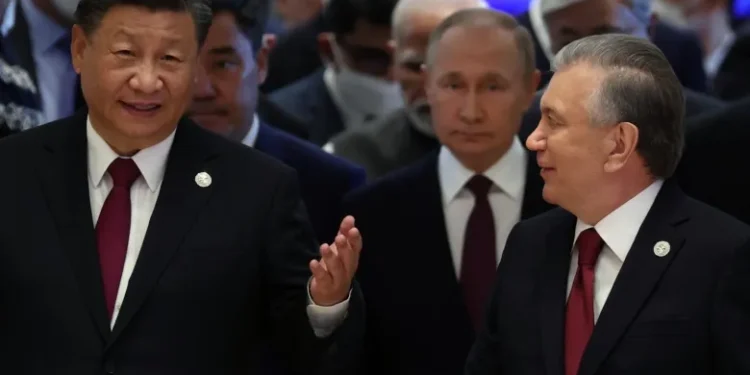 Xi Jinping, and his Russian and Uzbek counterparts, Vladimir Putin and Shavkat Mirziyoyev